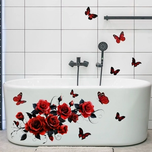 Red rose and butterfly wall decals applied to a modern white bathtub and tile bathroom wall