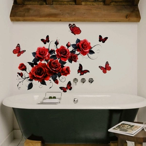 Close-up of red rose and butterfly wall stickers applied on a white bathroom wall