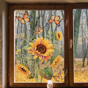 Detailed window decal featuring sunflowers and butterflies with autumn forest background