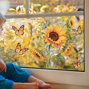 Detail of sunflower and butterfly window decals applied on a glass pane in a cozy home setting