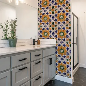 Moroccan geometric star wall stickers in orange and blue applied to bathroom walls