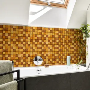 Detail of warm-toned mosaic tile wall stickers in a modern bathroom backsplash setting
