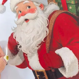 Detail view of double-sided Santa Claus window sticker with colorful patterns and transparency