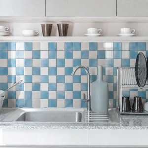 Kitchen backsplash featuring blue and white checkered marble texture wall tiles