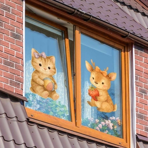Detailopname van aquarel raamstickers met kat en hert op glas voor raamdecoratie