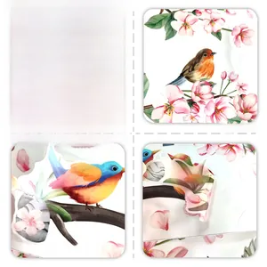 Detail of pink cherry blossoms and bird wall stickers showing adhesive backing and texture