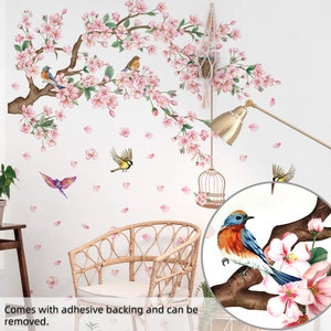 Detailed close-up showing pink cherry blossoms, birds, and birdcage wall stickers for home