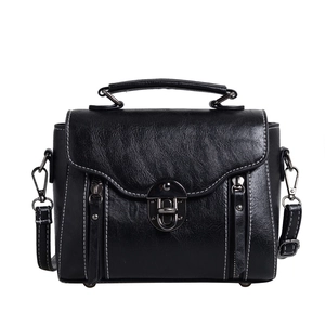 Classic black leather satchel bag with silver clasp and contrast stitching detail
