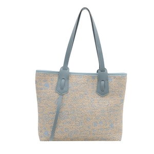 Chic woven tote bag with light blue pattern and faux leather straps for summer style