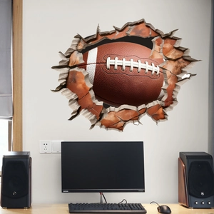 3D wall sticker featuring a realistic American football breaking through a brick wall