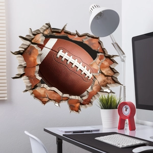 3D football breaking through a red brick wall decal for living room and bedroom decor