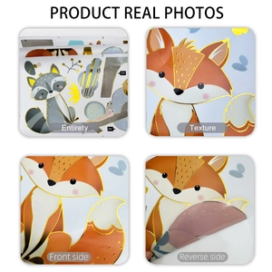 Detail of cartoon fox and raccoon wall stickers with golden foil edges and waterproof texture