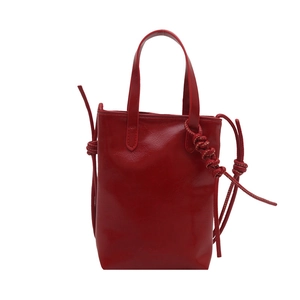 Red glossy leather mini tote bag with Fashion Paris embossing and long shoulder strap