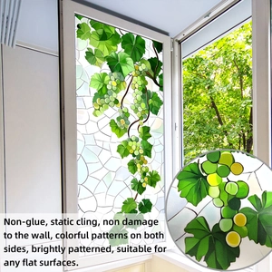 Detail of green grape vine static cling window film showing realistic leaves and fruit