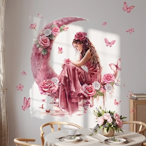 Detail of watercolor girl sitting on crescent moon wall sticker in a dining room setup