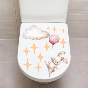 Self-adhesive bathroom sticker with cute rabbit holding a balloon on toilet lid
