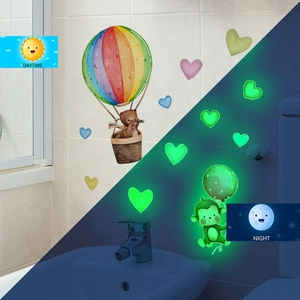 Luminous animal wall stickers showing daytime colors and green night glow effect