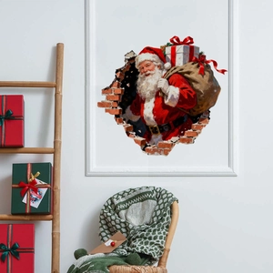 3D Christmas wall sticker showing Santa Claus with gifts bursting through a cracked wall