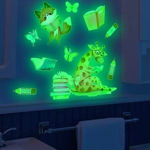 Glow in the dark wall stickers featuring cartoon animals and books in bright green