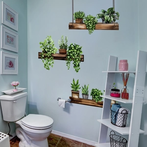 Self-adhesive 3D wall stickers featuring green potted plants and wooden shelf design