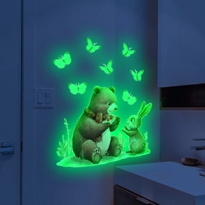 Luminous wall stickers featuring cartoon bear and rabbit glowing in the dark
