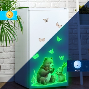 Luminous wall stickers with forest animals showing day and night green glow effect