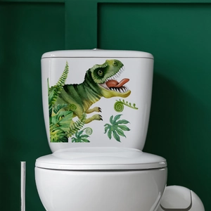 Detailed view of green cartoon dinosaur and tropical leaf waterproof stickers on a toilet tank