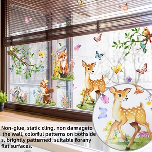 Detail of forest animal static cling window stickers showing watercolor fox and deer motifs