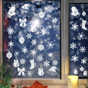 Detailed view of white Christmas window decals featuring snowflakes and holiday ornaments