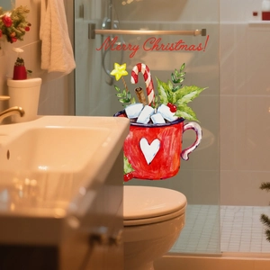 Detail of Christmas window cling showing watercolor red mug with candy canes on glass