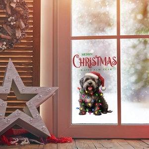 Detailed view of Christmas window sticker featuring a dog with lights and festive greetings