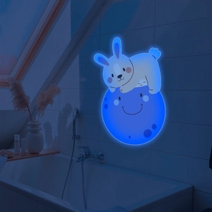 Blue glowing wall light featuring a cute cartoon rabbit resting on a smiling crescent moon