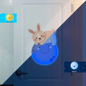 Luminous wall sticker showing bunny on moon in daytime and glowing night effects