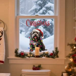 Detail of Christmas window sticker featuring a cute dog with Santa hat and festive lights