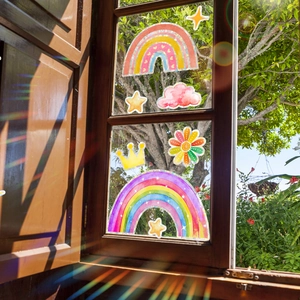 Colorful rainbow and star electrostatic window film showing sun-catcher refraction effect