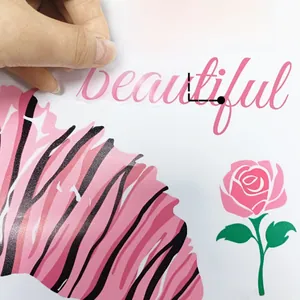 Detail showing the removable pink 'beautiful' wall sticker being peeled from its backing