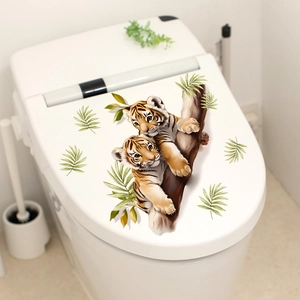 Cartoon tiger and green leaves wall sticker applied on a white toilet cover decor