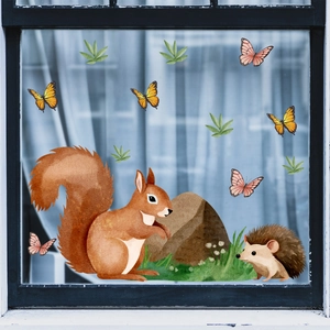 Detail of forest animal static window clings featuring watercolor squirrel and hedgehog