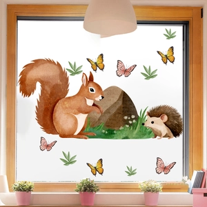 Detail of watercolor forest window stickers featuring squirrel and hedgehog in a home setting