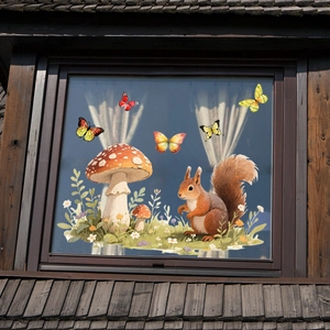 Close-up of squirrel and mushroom window stickers on dark wood attic frame glass