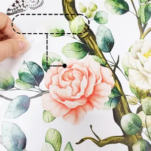 Detailed close-up showing the removable adhesive backing of the floral wall sticker