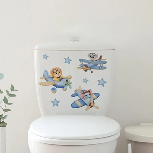Detail of blue cartoon animals airplane wall stickers on white ceramic toilet tank