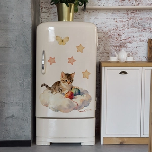 Close-up of cute cartoon cat on blue cloud wall sticker applied on a white fridge