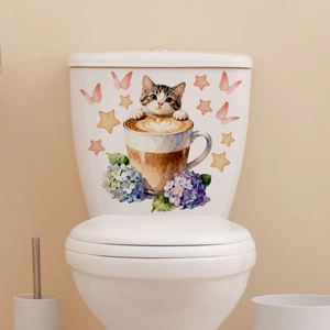 Detail showing a watercolor cat in coffee cup sticker on a white ceramic toilet tank
