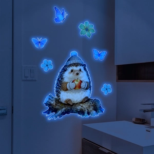 Luminous blue glow wall decal featuring a cartoon hedgehog with apple and butterflies