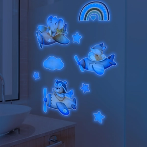 Glow-in-the-dark wall stickers showing cartoon animals flying planes with blue fluorescent stars
