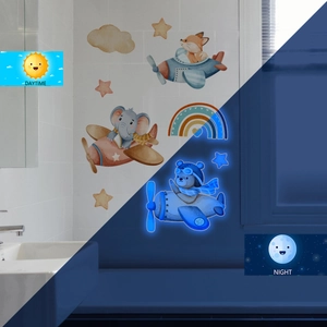 Glow in the dark cartoon fox and elephant wall stickers showing day and night contrast