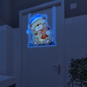 Glow-in-the-dark teddy bear on swing wall sticker with blue luminous outline detail