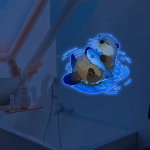 Glow-in-the-dark cartoon sea otter wall sticker with blue luminous effect in bathroom