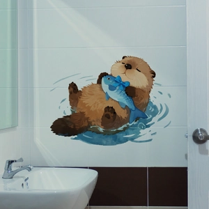 Close-up of cute cartoon otter wall sticker on white bathroom tile background